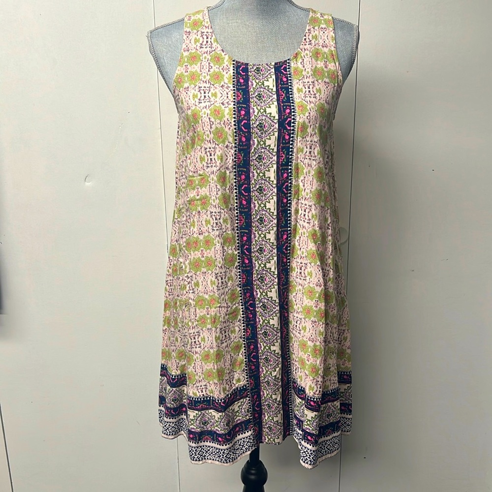 Lightweight, colorful sleeveless summer dress.